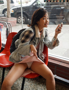 Young asian girl tourist flashing her panties in