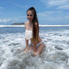 Beach babe in tiny bikini