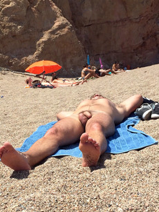 A naked guy sunbathing near me